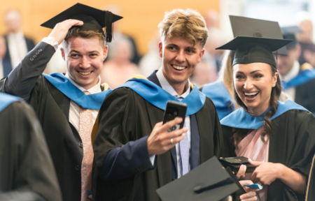 Medicine Conferring 2024 Three students smiling